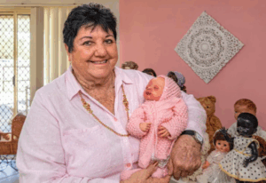 Show birthday icing on cake for Val