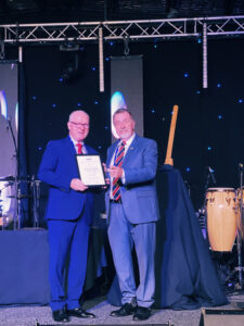 Tully collects 40-year gong