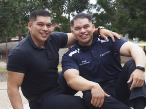 Ipswich twins cross the graduation stage together